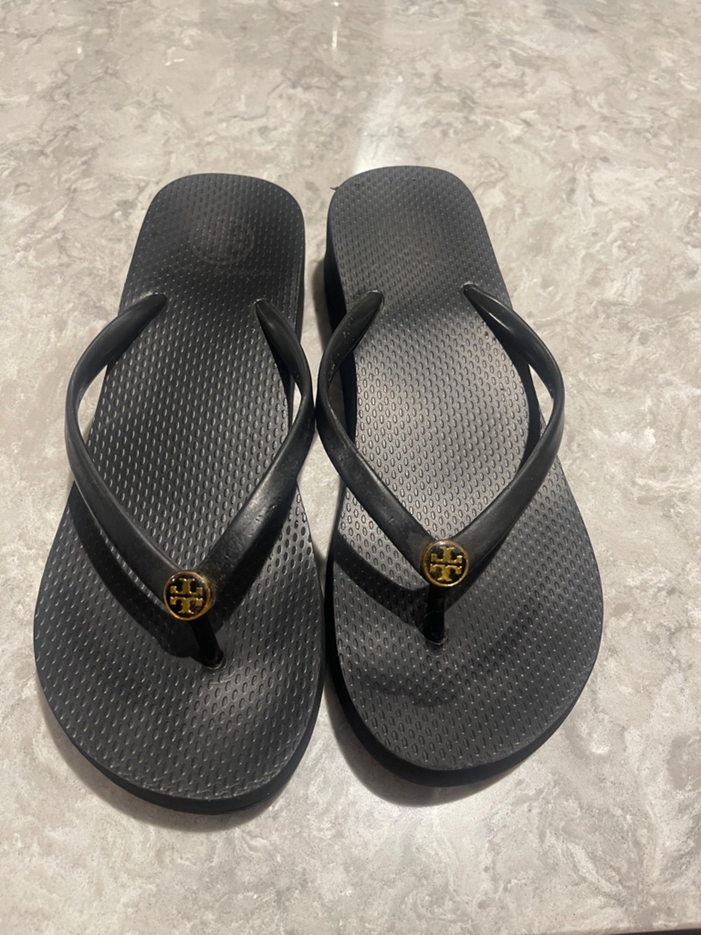 Tory Burch Black Flip Flop Sandals with Gold Logo Medallions